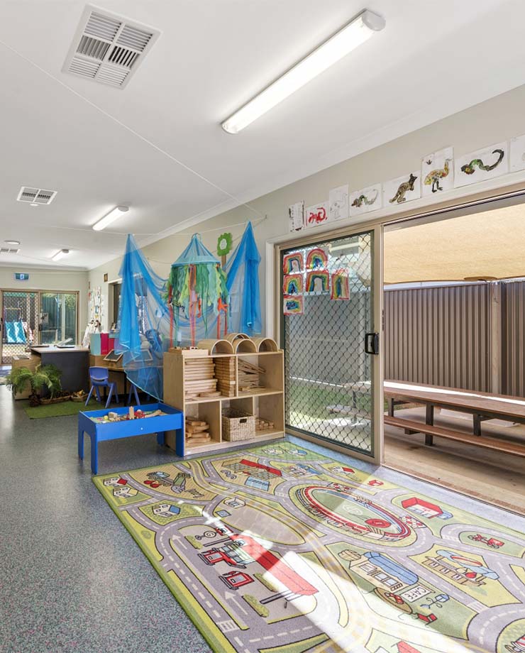 Kate's Place interior play and learning area with car themed mat